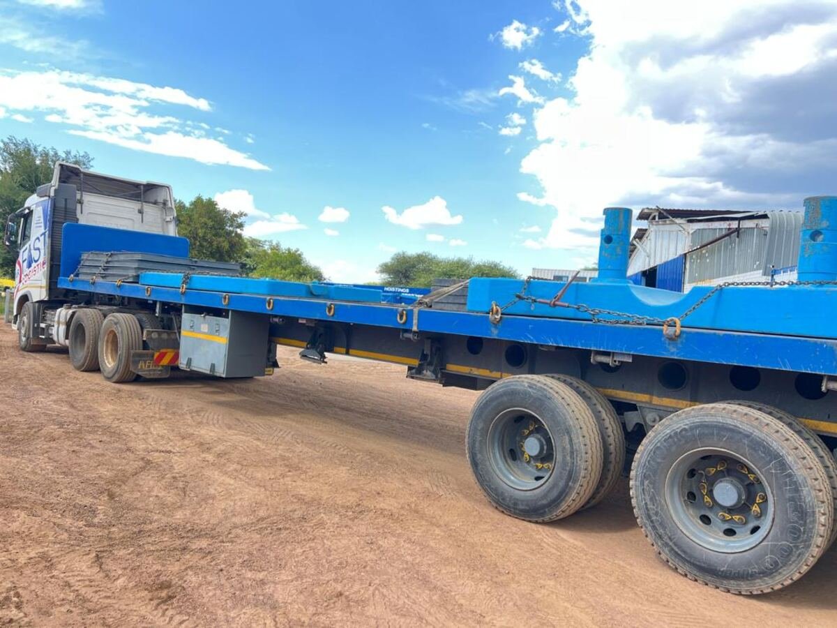 Loaded flatdeck trailer at an Air Fast Logistics warehousing facility