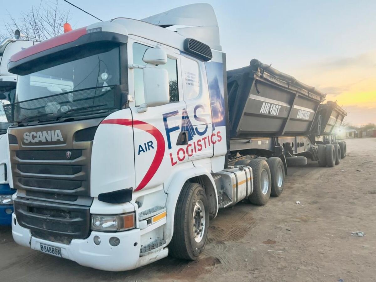 Air Fast Logistics Scania truck with side-tipper trailer at sunset